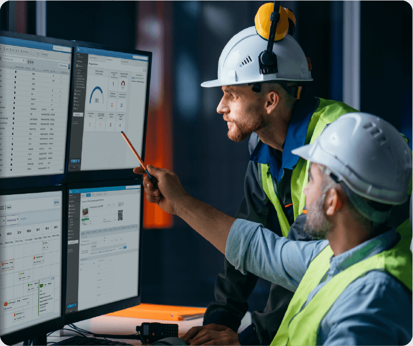 Maintenance worker in a hard hat holding a tablet